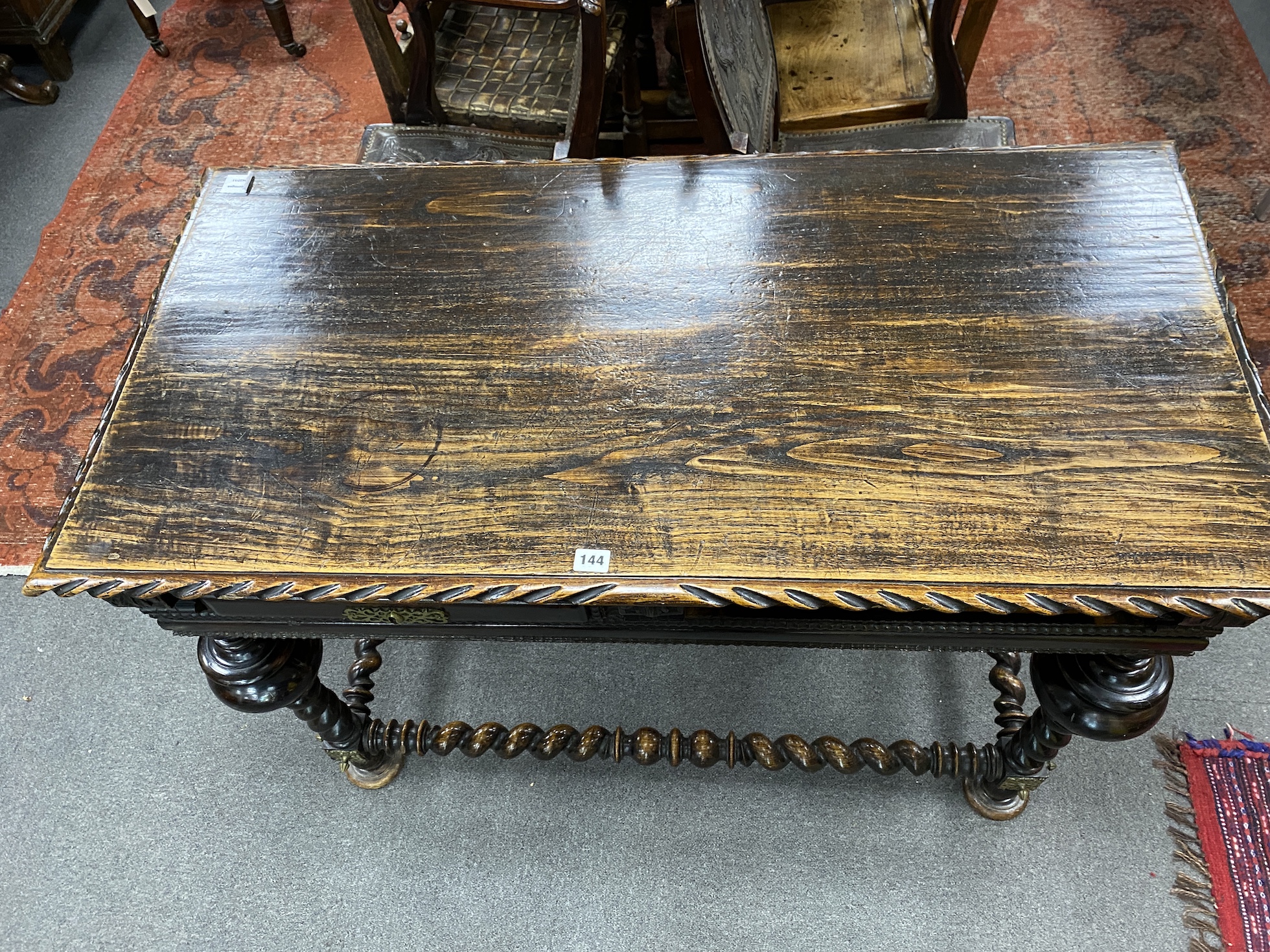 A 19th century Portuguese table, raised on turned twisted supports and stretchers, width 115cm, depth 59cm, height 82cm